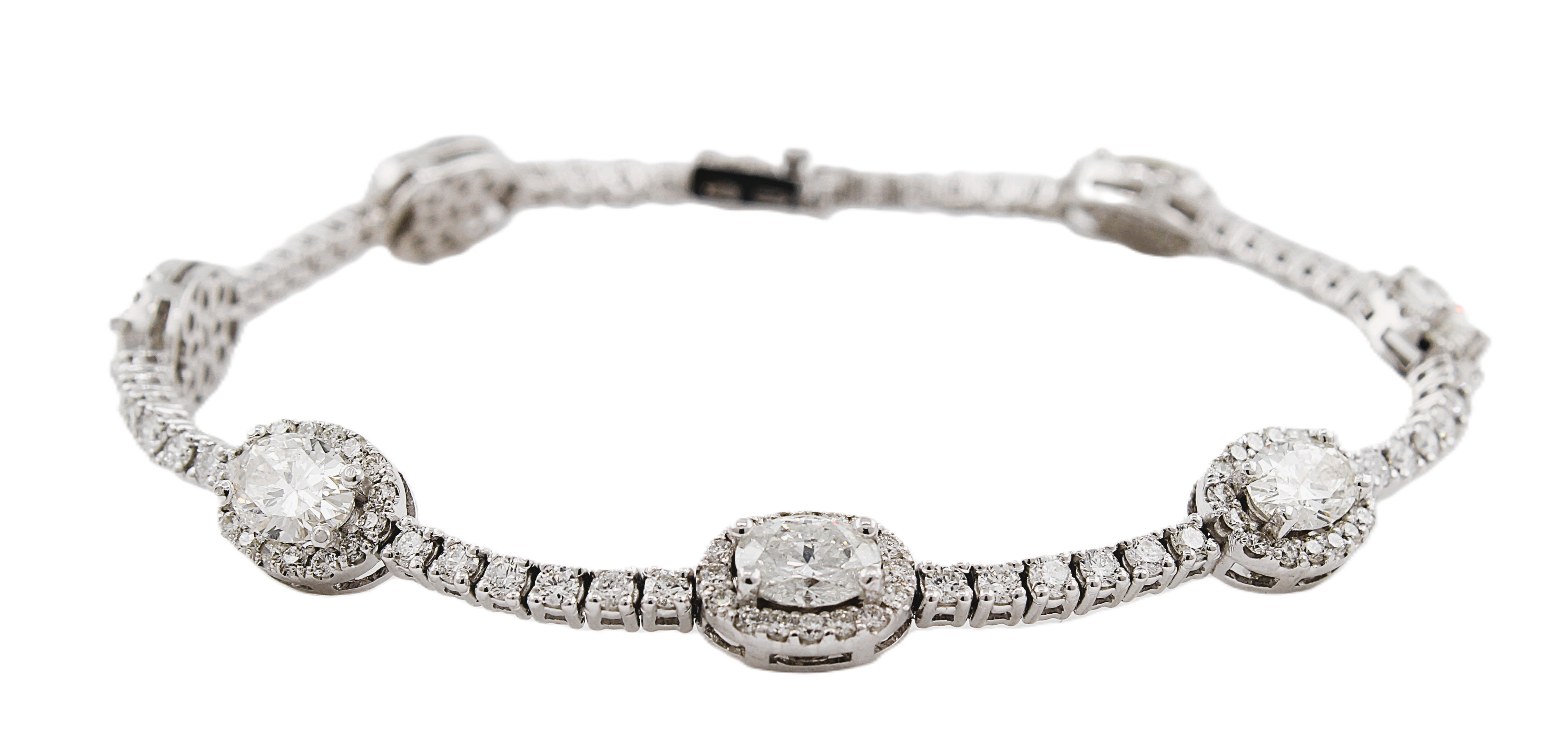 Round & Oval Cut Diamond Tennis Bracelet with Halo's